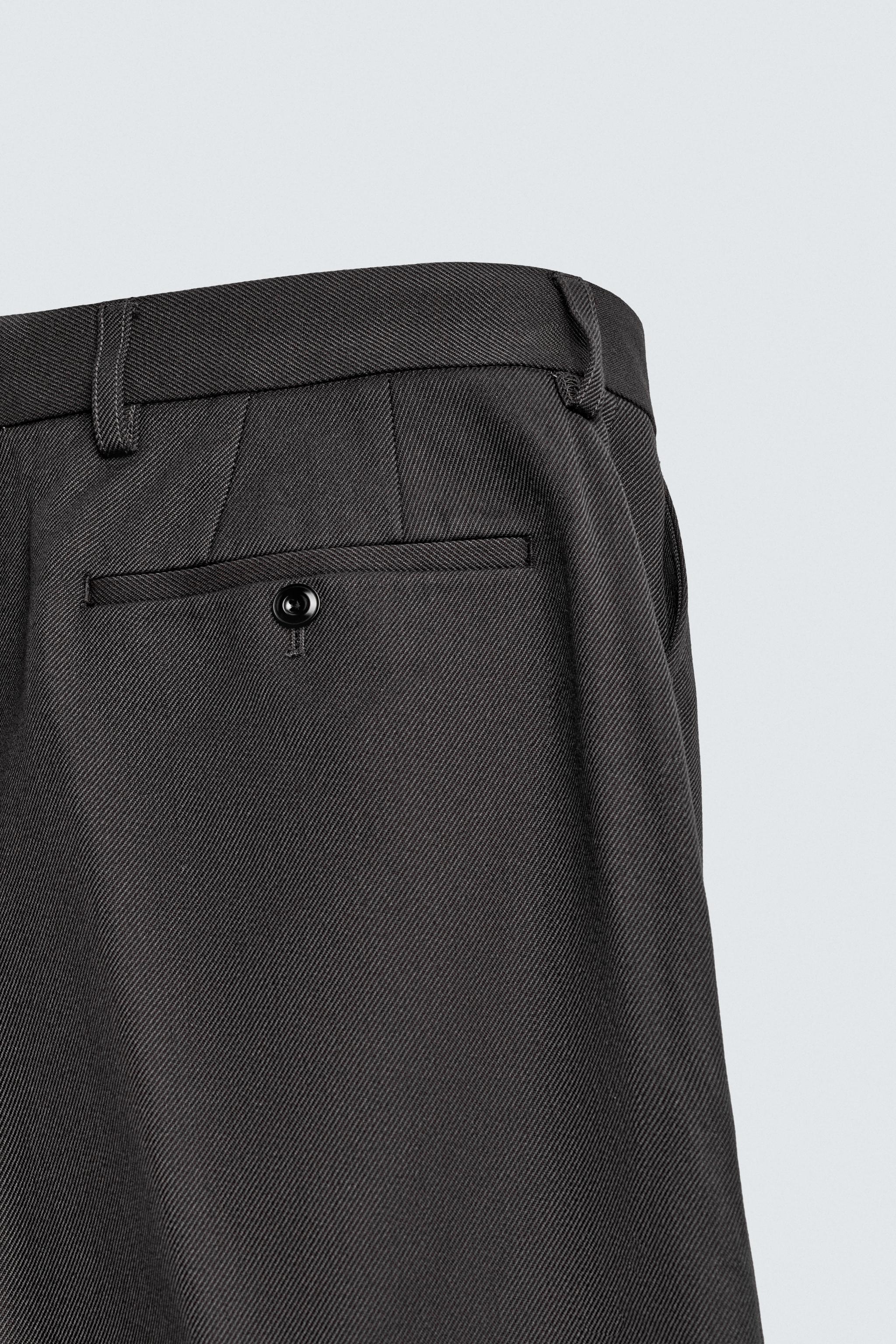 TEXTURED PLEATED PANTS